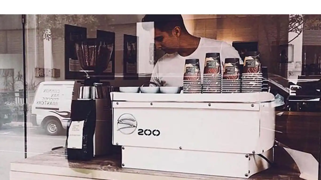 Commercial espresso machine on a working bar